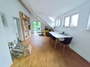 a living room with a table and a couch at N13 Living in Wangen im Allgäu