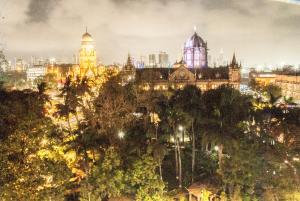 a view of a city at night with lights at City Hotel in Mumbai
