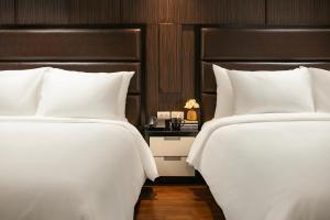 Voodi või voodid majutusasutuse La Nueva Boutique Hotel Hanoi & Spa toas