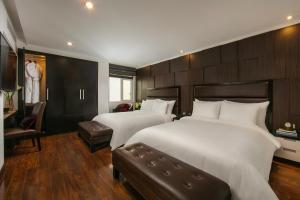 Voodi või voodid majutusasutuse La Nueva Boutique Hotel Hanoi & Spa toas