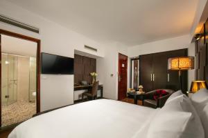 Voodi või voodid majutusasutuse La Nueva Boutique Hotel Hanoi & Spa toas