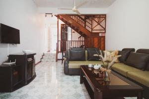 a living room with a couch and a table at Pereybere View Complex, Villa No 2 in Pereybere