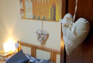 a wedding dress hanging on the door of a bedroom at Gabriel Holiday House in Rome