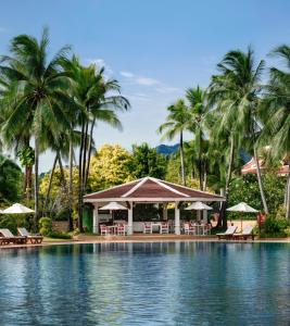 a pool at a resort with palm trees and a gazebo at Santiburi Koh Samui in Mae Nam