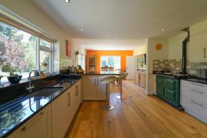 a large kitchen with a sink and a counter at The Quackery in Langport