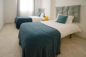 Postel nebo postele na pokoji v ubytování Apartamento Valle Romano + 37 fotografií