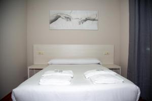 Una cama o camas en una habitación de Casa Seoane
