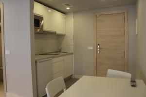 Kuchyň nebo kuchyňský kout v ubytování Modo Hotel Apartamento
