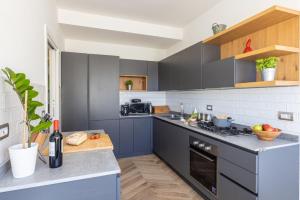 A kitchen or kitchenette at SorrentoVibes - Amazing Home with terrace & view Sorrento Center