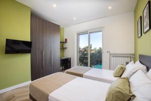 A bed or beds in a room at SorrentoVibes - Amazing Home with terrace & view Sorrento Center