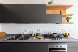 A kitchen or kitchenette at SorrentoVibes - Amazing Home with terrace & view Sorrento Center