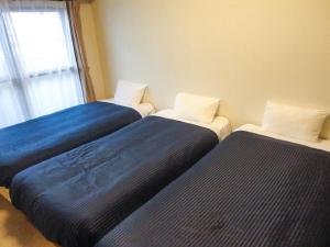 Postelja oz. postelje v sobi nastanitve HOTEL LiVEMAX BUDGET Nagoya