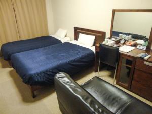 Postelja oz. postelje v sobi nastanitve HOTEL LiVEMAX BUDGET Nagoya