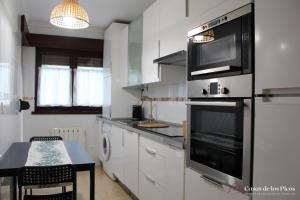 Kuchyň nebo kuchyňský kout v ubytování Apartamento Nansa - Casas de los Picos + 9 fotografií