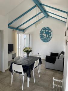a dining room with a table and chairs at Apartments Bakula in Mandre