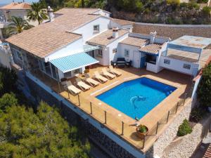 an aerial view of a house with a swimming pool at Holiday Home Stuttgart by Interhome in Cumbre del Sol