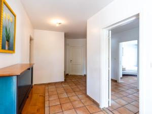 a kitchen with white walls and a tile floor at Holiday Home St- Joseph by Interhome in Propriano