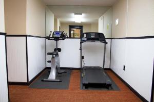 a gym with a treadmill and a elliptical machine at Gatlinburg Town Square by Exploria Resorts in Gatlinburg
