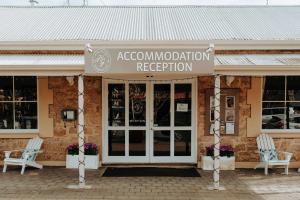 a store with two chairs in front of a building at The Manna, Ascend Hotel Collection in Hahndorf