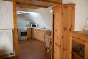a kitchen with a sink and a stove top oven at Ferienwohnung-Ihle Olbernhau in Olbernhau