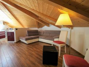 a living room with a couch and a table at Apartment I Monili-4 by Interhome in Moneglia