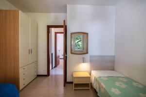 Postel nebo postele na pokoji v ubytování Villa Luca Trilocale 3