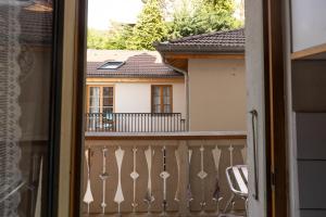 a balcony with a view of a house at Studio en centre village St Gervais in Saint-Gervais-les-Bains