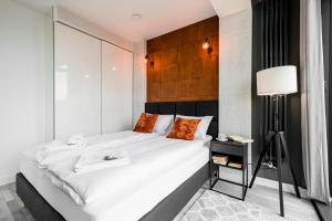 Posteľ alebo postele v izbe v ubytovaní Q18 ApartHotel