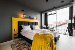 Posteľ alebo postele v izbe v ubytovaní Q18 ApartHotel