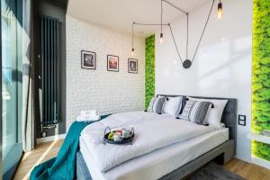 Posteľ alebo postele v izbe v ubytovaní Q18 ApartHotel