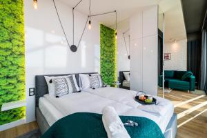 Posteľ alebo postele v izbe v ubytovaní Q18 ApartHotel