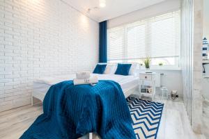 Posteľ alebo postele v izbe v ubytovaní Q18 ApartHotel