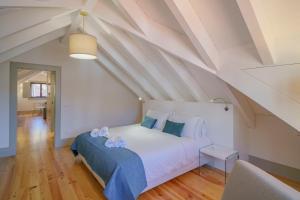 Ένα ή περισσότερα κρεβάτια σε δωμάτιο στο Feel Porto Matosinhos Ocean Flats