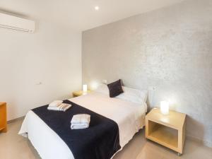 Ein Bett oder Betten in einem Zimmer der Unterkunft Apartment Misefo by Interhome