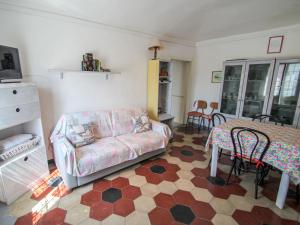 a living room with a couch and a table at Apartment Casa Centrale by Interhome in Moneglia