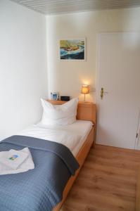Letto o letti in una camera di Hotel Südstrand Amrum