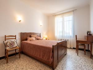 En eller flere senger på et rom på Holiday Home La Vigneronne by Interhome