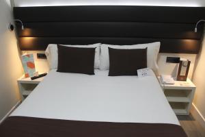 Postel nebo postele na pokoji v ubytování BCN Urbaness Hotels Del Comte