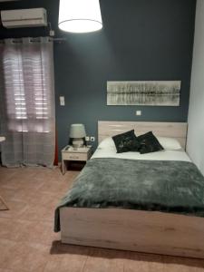 Posteľ alebo postele v izbe v ubytovaní Avra Rooms
