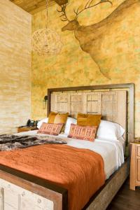 Ένα ή περισσότερα κρεβάτια σε δωμάτιο στο Ancient Lore Village