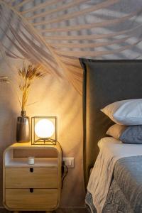 Postel nebo postele na pokoji v ubytování Zephir Apartments