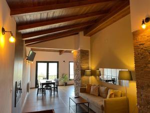 a living room with a couch and a table at FINCA LAS DEHESILLAS in Monesterio