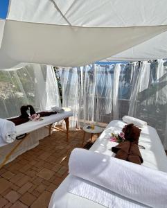 two beds in a room with a tent at SunVilla in Koper