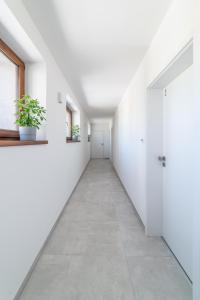an empty hallway with white walls and a door at 4 pokoje in Ostrava