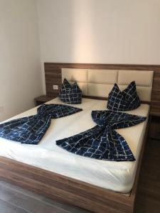 Postel nebo postele na pokoji v ubytování Bashi's Apartments
