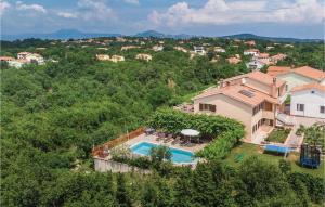 an aerial view of a house with a swimming pool at 7 Bedroom Nice Home In Labin in Labin