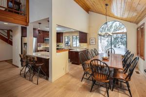 a kitchen and dining room with a table and chairs at Snowpeak Oasis in Truckee