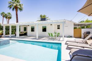 a villa with a swimming pool and a house at Movie Colony Bungalow Permit# 3364 in Palm Springs