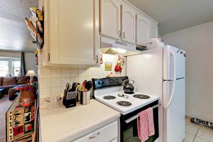a kitchen with a stove and a white refrigerator at Apache Adventures in South Lake Tahoe