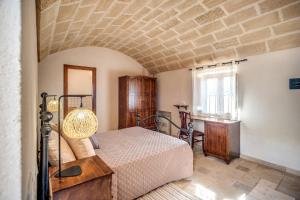 Łóżko lub łóżka w pokoju w obiekcie Trullo La Succulenta
